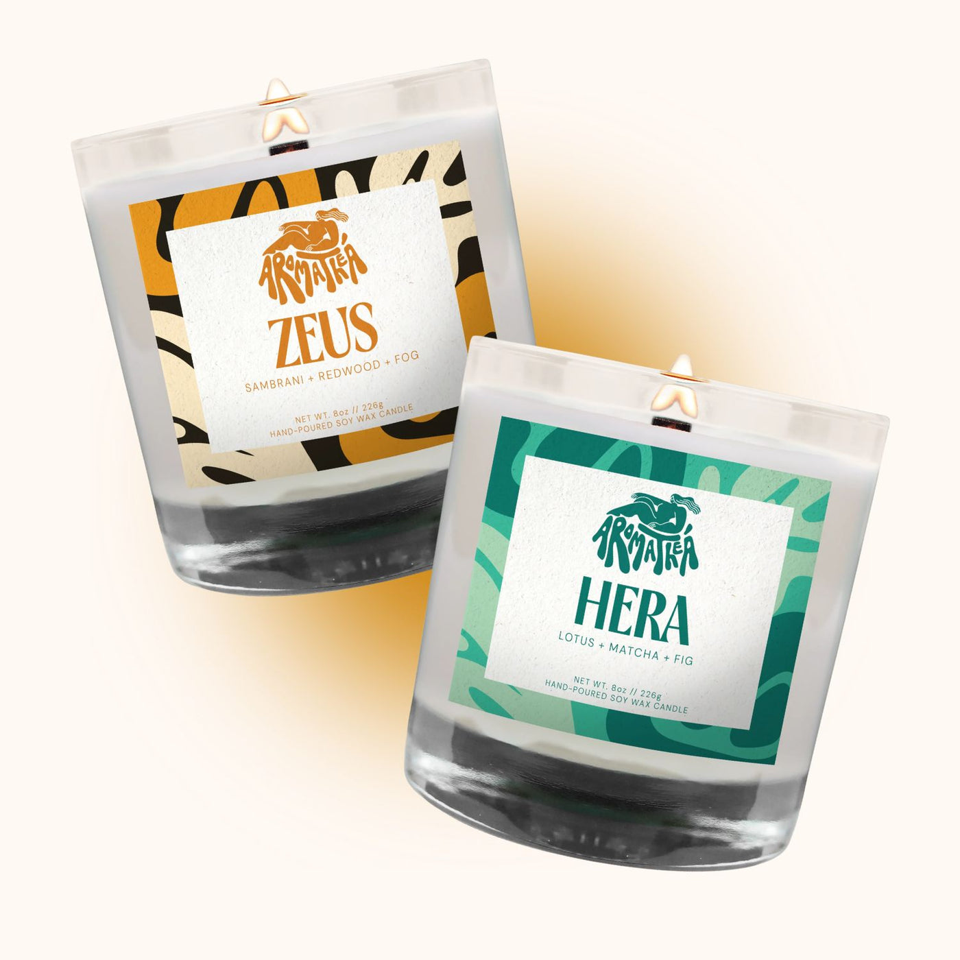 Two candles labeled 'Zeus' and 'Hera' with decorative labels on a white background.